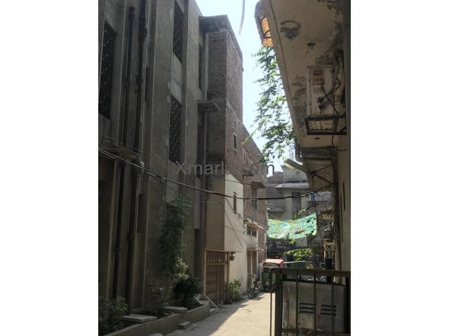 12 Marla house with shops is available for sale at prime location in Lahore