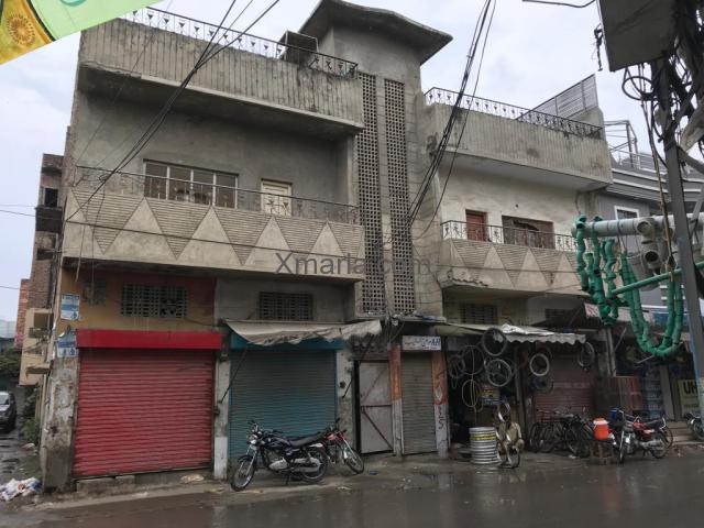 12 Marla house with shops is available for sale at prime location in Lahore