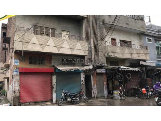12 Marla house with shops is available for sale at prime location in Lahore