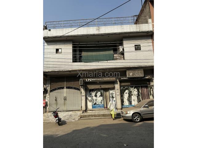 10 Marla House with 2 commercial shops - 50ft road in front