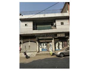 10 Marla House with 2 commercial shops - 50ft road in front