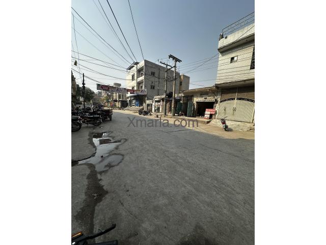 10 Marla House with 2 commercial shops - 50ft road in front