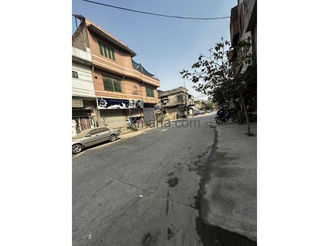 10 Marla House with 2 commercial shops - 50ft road in front